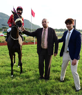 Brightest Star (S Saqlain up) winner of the B.R.HILLS PLATE (DIV-II), being led in by trainer Eshwer M on Wednesday races at Mysore.